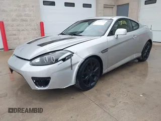 2008 Hyundai Tiburon GT z VIN KMHHN66F18U268929, wystawiony jako IAAI lot #42107550 z przebiegiem 142 547 mil mil oraz . Historia ofert i sprzedaży dostępna na DreamBid. Obrazek 2.