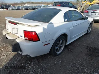 2003 Ford Mustang GT Deluxe with VIN 1FAFP42X03F309689, listed as a IAAI auction lot 41360816 with 999,999 mi miles. Bid and sale history available at carsss.com. Image 4.