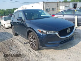 2018 Mazda CX-5 Touring z VIN JM3KFACM8J1442247, wystawiony jako IAAI lot #42406444 z przebiegiem 103 837 mil mil oraz . Historia ofert i sprzedaży dostępna na DreamBid. Obrazek 1.