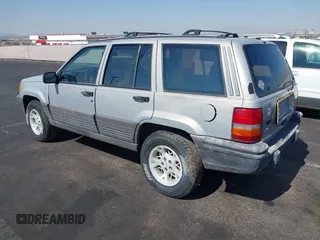 1994 Jeep Grand Cherokee Laredo with VIN 1J4GZ58S4RC325909, listed as a IAAI auction lot 39580601 with 162,952 mi miles. Bid and sale history available at carsss.com. Image 3.