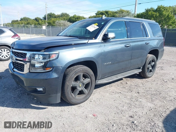 2020 Chevrolet Tahoe LT with VIN 1GNSCBKC4LR246060, listed as a IAAI auction lot 41272902 with 105,417 mi miles and . Bid and sale history available at DreamBid. Image 2.