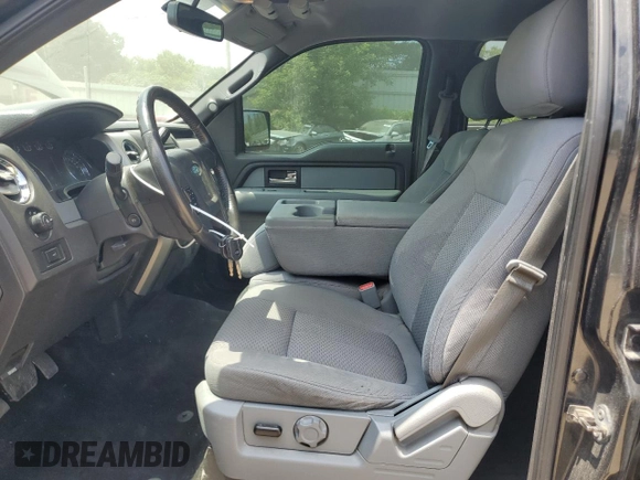 2014 Ford F-150 XL with VIN 1FTFW1EFXEFB04995, listed as a Copart auction lot 60883835 with 176,136 mi miles and Clean title. Bid and sale history available at DreamBid. Image 7.