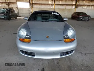 1997 Porsche Boxster с VIN WP0CA2984VS621039, выставлен на аукционе Copart как лот 60274455 с пробегом 59 619 миль миль и Списание • Salvage title. История ставок и продаж доступна на DreamBid. Изображение 5.