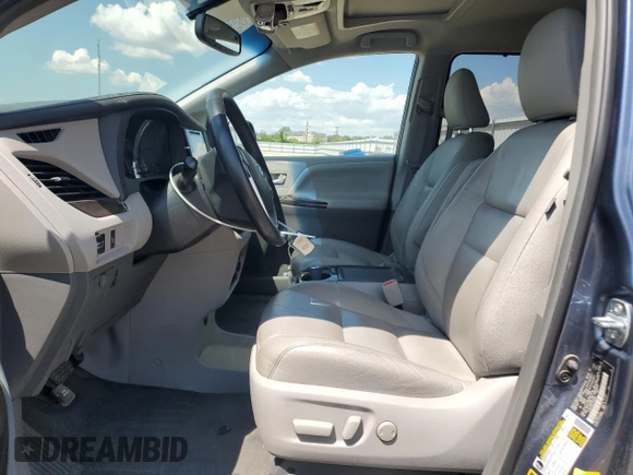 2015 Toyota Sienna XLE with VIN 5TDYK3DC4FS619385, listed as a Copart auction lot 57090385 with 112,896 mi miles and Salvage title. Bid and sale history available at DreamBid. Image 7.