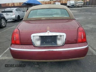 1999 Lincoln Town Car Signature with VIN 1LNHM82W7XY612906, listed as a Copart auction lot 50777435 with 110,414 mi miles and Salvage title. Bid and sale history available at DreamBid. Image 6.