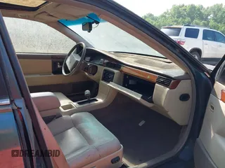 1992 Cadillac Seville z VIN 1G6KS53B4NU818363, wystawiony jako IAAI lot #42357836 z przebiegiem 91 439 mil mil oraz . Historia ofert i sprzedaży dostępna na DreamBid. Obrazek 5.