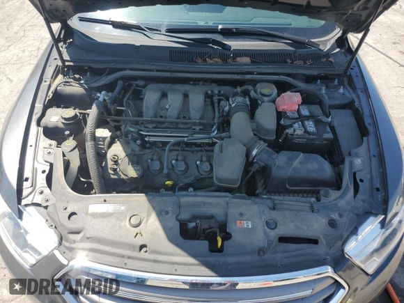 2015 Ford Taurus SEL z VIN 1FAHP2E83FG125234, wystawiony jako Copart lot #54404745 z przebiegiem 107 311 mil mil oraz Szkody całkowita. Historia ofert i sprzedaży dostępna na DreamBid. Obrazek 11.