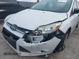 2013 Ford Focus S with VIN 1FADP3E20DL332636, listed as a IAAI auction lot 40917274 with 112,956 mi miles. Bid and sale history available at carsss.com. Image 6.