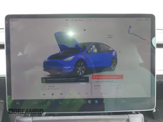 2022 Tesla Model Y Long Range z VIN 7SAYGAEE5NF428327, wystawiony jako IAAI lot #41698750 z przebiegiem 26 846 mil mil oraz . Historia ofert i sprzedaży dostępna na DreamBid. Obrazek 18.
