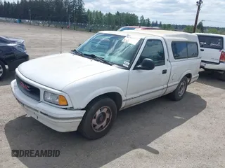 1997 GMC Sonoma z VIN 1GTCS1443VK511286, wystawiony jako IAAI lot #42236026 z przebiegiem 154 768 mil mil oraz . Historia ofert i sprzedaży dostępna na DreamBid. Obrazek 2.