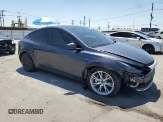 2024 Tesla Model Y Long Range with VIN 7SAYGDEE6RA226035, listed as a Copart auction lot 52539375 with 14,220 mi miles and Salvage title. Bid and sale history available at DreamBid. Image 4.