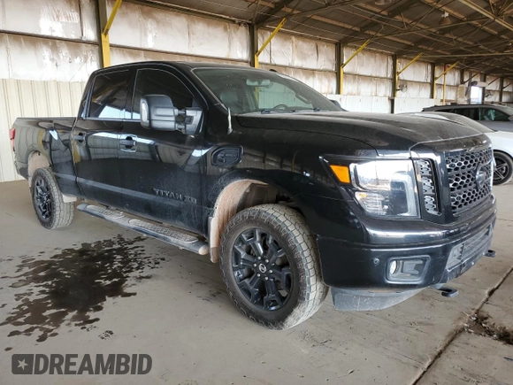 2019 Nissan Titan XD SL with VIN 1N6BA1F47KN534864, listed as a Copart auction lot 65651974 with 79,230 mi miles and Salvage Title. Bid and sale history available at carsss.com. Image 4.