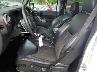 2016 Jeep Wrangler Unlimited Sahara z VIN 1C4HJWEGXGL198684, wystawiony jako Copart lot #49936525 z przebiegiem 158 396 mil mil oraz Szkoda całkowita • Salvage title. Historia ofert i sprzedaży dostępna na DreamBid. Obrazek 7.