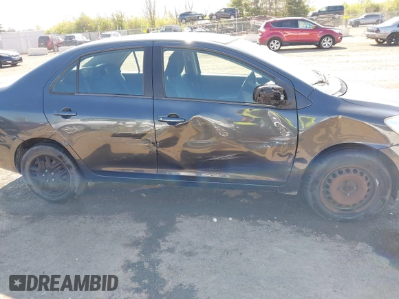 2009 Toyota Yaris with VIN JTDBT903194047784, listed as a IAAI auction lot 42049872 with 115,735 mi miles. Bid and sale history available at carsss.com. Image 6.