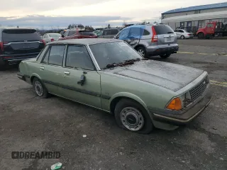 1981 Mazda 626 z VIN JM1GB2216B0531636, wystawiony jako Copart lot #85505404 z przebiegiem 41 816 mil mil oraz Szkoda całkowita • Salvage title. Historia ofert i sprzedaży dostępna na DreamBid. Obrazek 4.