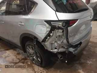 2021 Mazda CX-5 Grand Touring with VIN JM3KFADMXM1318015, listed as a IAAI auction lot 41221528 with 79,473 mi miles. Bid and sale history available at carsss.com. Image 6.