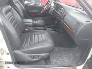 1998 Jeep Grand Cherokee Laredo with VIN 1J4GZ48S3WC204990, listed as a IAAI auction lot 41704176 with 185,376 mi miles. Bid and sale history available at carsss.com. Image 5.