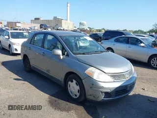 2007 Nissan Versa SL with VIN 3N1BC11E77L407779, listed as a IAAI auction lot 42572525 with 167,431 mi miles and . Bid and sale history available at DreamBid. Image 1.