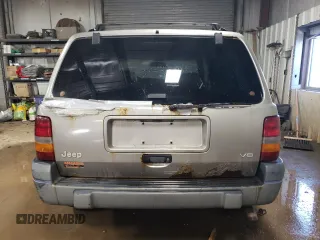 1997 Jeep Grand Cherokee Laredo with VIN 1J4GZ58Y7VC650813, listed as a Copart auction lot 41486724 with 266,004 mi miles and Salvage Title. Bid and sale history available at carsss.com. Image 6.