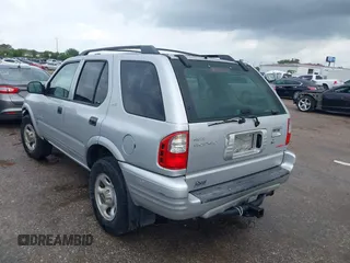2001 Isuzu Rodeo S with VIN 4S2DM58WX14352481, listed as a IAAI auction lot 42152621 with 162,696 mi miles. Bid and sale history available at carsss.com. Image 3.