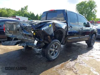 2013 Nissan Titan Pro-4X with VIN 1N6BA0EC4DN305032, listed as a IAAI auction lot 42341681 with 118,251 mi miles and . Bid and sale history available at DreamBid. Image 4.