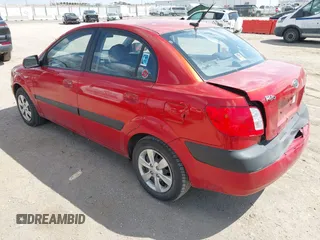 2009 Kia Rio SX with VIN KNADE223396484470, listed as a IAAI auction lot 41964027 with 167,380 mi miles. Bid and sale history available at carsss.com. Image 3.