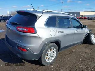 2014 Jeep Cherokee Latitude with VIN 1C4PJMCBXEW107559, listed as a IAAI auction lot 41859246 with 94,812 mi miles and . Bid and sale history available at DreamBid. Image 4.
