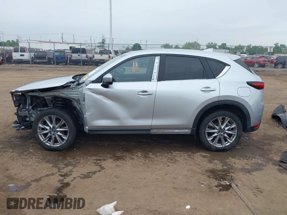 2021 Mazda CX-5 Grand Touring with VIN JM3KFBDM4M0371496, listed as a IAAI auction lot 42428860 with 113,735 mi miles and . Bid and sale history available at DreamBid. Image 15.