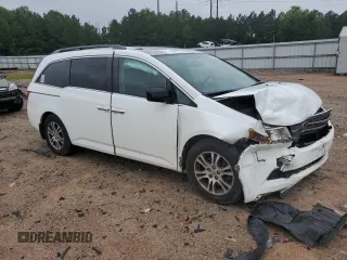 2013 Honda Odyssey EX-L with VIN 5FNRL5H62DB048370, listed as a Copart auction lot 63013465 with 129,552 mi miles and Salvage title. Bid and sale history available at DreamBid. Image 4.