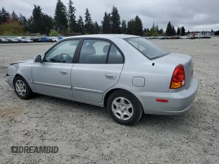 2005 Hyundai Accent GLS z VIN KMHCG45C75U639281, wystawiony jako Copart lot #54887095 z przebiegiem 136 090 mil mil oraz Szkoda całkowita • Salvage title. Historia ofert i sprzedaży dostępna na DreamBid. Obrazek 2.