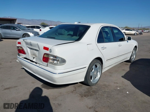 2002 Mercedes-Benz E-Class with VIN WDBJF82J62X076581, listed as a IAAI auction lot 41194976 with 235,453 mi miles. Bid and sale history available at carsss.com. Image 4.