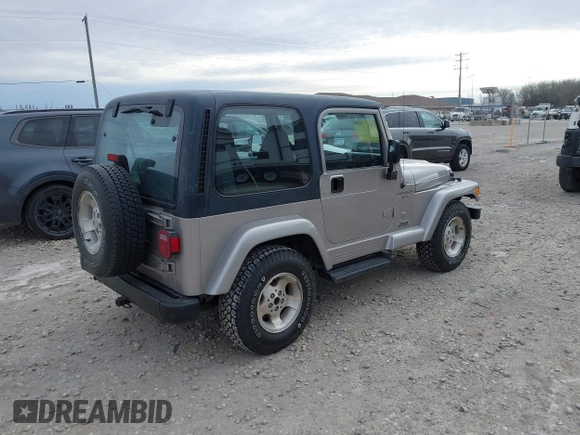 2001 Jeep Wrangler Sport z VIN 1J4FA49S31P349269, wystawiony jako IAAI lot #41427014 z przebiegiem 112 421 mil mil oraz . Historia ofert i sprzedaży dostępna na DreamBid. Obrazek 4.