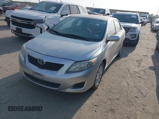 2009 Toyota Corolla with VIN 1NXBU40E59Z078727, listed as a IAAI auction lot 42035739 with 113,814 mi miles. Bid and sale history available at carsss.com. Image 2.