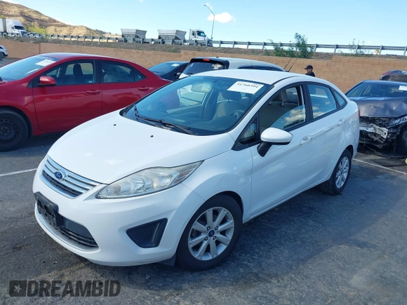2012 Ford Fiesta SE with VIN 3FADP4BJ7CM102932, listed as a IAAI auction lot 41760394 with 70,394 mi miles and . Bid and sale history available at carsss.com. Image 2.