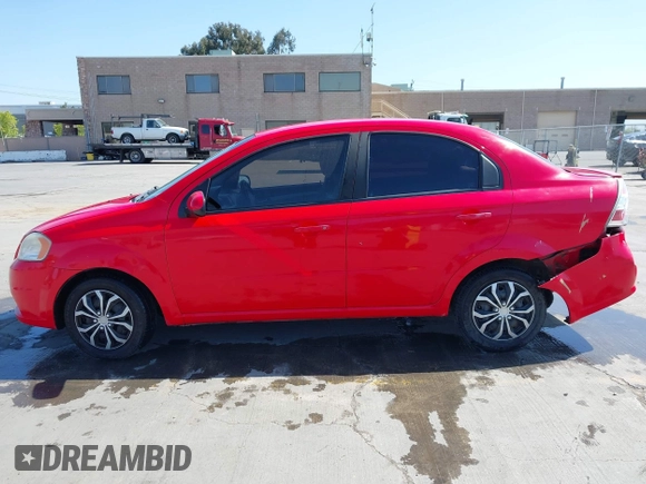 2011 Chevrolet Aveo 1LT z VIN KL1TD5DE0BB151956, wystawiony jako IAAI lot #42083842 z przebiegiem 115 607 mil mil oraz . Historia ofert i sprzedaży dostępna na DreamBid. Obrazek 14.