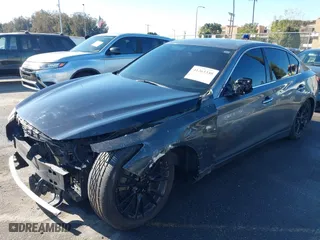 2015 Infiniti Q50 with VIN JN1BV7AP3FM346756, listed as a IAAI auction lot 41263330 with 144,991 mi miles. Bid and sale history available at carsss.com. Image 17.
