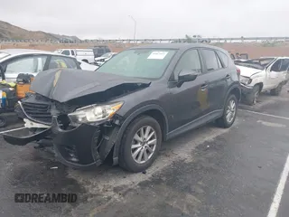 2016 Mazda CX-5 Touring with VIN JM3KE2CY7G0630056, listed as a IAAI auction lot 41817525 with 97,844 mi miles and . Bid and sale history available at DreamBid. Image 17.
