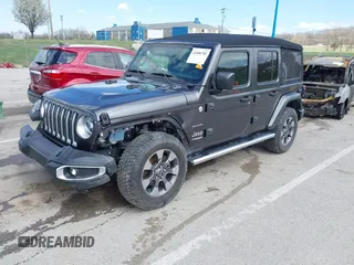 2019 Jeep Wrangler Unlimited Sahara with VIN 1C4HJXEN3KW622167, listed as a IAAI auction lot 41880702 with 72,928 mi miles and . Bid and sale history available at DreamBid. Image 19.