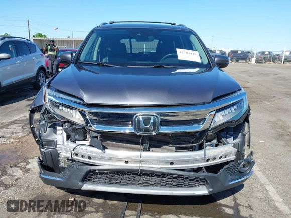 2021 Honda Pilot Touring 8-Passenger with VIN 5FNYF6H97MB034399, listed as a IAAI auction lot 42303419 with 50,034 mi miles and . Bid and sale history available at DreamBid. Image 13.