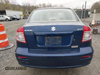2011 Suzuki SX4 LE with VIN JS2YC5A23B6304713, listed as a IAAI auction lot 41997287 with 114,024 mi miles. Bid and sale history available at carsss.com. Image 16.