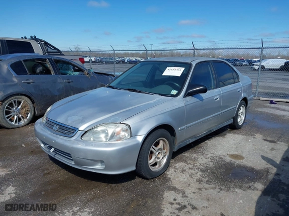 1999 Honda Civic VP with VIN 2HGEJ6615XH528453, listed as a IAAI auction lot 41655363 with 163,816 mi miles. Bid and sale history available at carsss.com. Image 2.