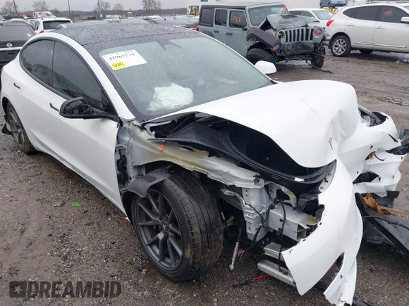 2022 Tesla Model 3 Long Range with VIN 5YJ3E1EB0NF129945, listed as a IAAI auction lot 41965531 with 59,162 mi miles and . Bid and sale history available at DreamBid. Image 1.
