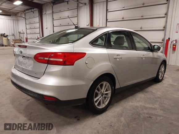 2017 Ford Focus SE z VIN 1FADP3F20HL245291, wystawiony jako IAAI lot #42194880 z przebiegiem 93 764 mil mil oraz . Historia ofert i sprzedaży dostępna na DreamBid. Obrazek 4.