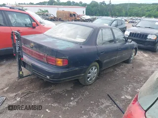 1993 Toyota Camry LE z VIN 4T1SK12E6PU248270, wystawiony jako IAAI lot #42160426 z przebiegiem 225 221 mil mil oraz . Historia ofert i sprzedaży dostępna na DreamBid. Obrazek 4.
