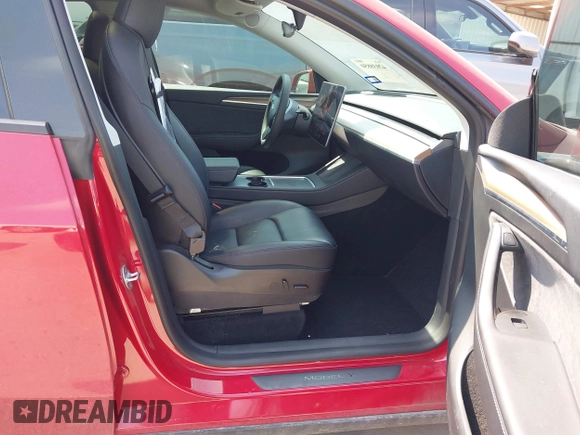 2023 Tesla Model Y Long Range z VIN 7SAYGAEE7PF691499, wystawiony jako IAAI lot #42038850 z przebiegiem 26 439 mil mil oraz . Historia ofert i sprzedaży dostępna na DreamBid. Obrazek 5.