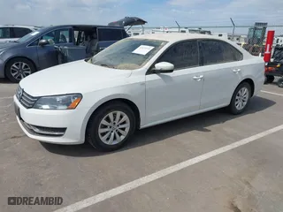 2014 Volkswagen Passat Wolfsburg Ed with VIN 1VWAT7A32EC099677, listed as a IAAI auction lot 41872416 with 182,392 mi miles. Bid and sale history available at carsss.com. Image 2.