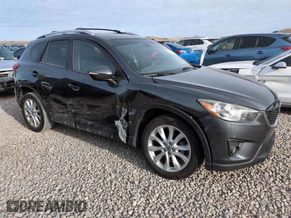 2015 Mazda CX-5 Grand Touring with VIN JM3KE4DY3F0495411, listed as a Copart auction lot 50077765 with 136,191 mi miles and Salvage Title. Bid and sale history available at DreamBid. Image 4.