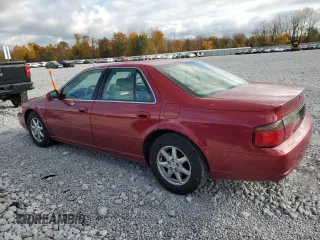1999 Cadillac Seville Touring STS z VIN 1G6KY5490XU919543, wystawiony jako Copart lot #77068624 z przebiegiem 142 772 mil mil oraz Szkoda całkowita • Salvage title. Historia ofert i sprzedaży dostępna na DreamBid. Obrazek 2.