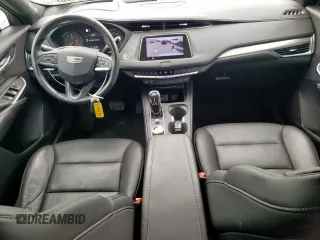 2023 Cadillac XT4 FWD Premium Luxury with VIN 1GYFZCR42PF110122, listed as a Copart auction lot 57332955 with 11,427 mi miles and Salvage title. Bid and sale history available at DreamBid. Image 8.