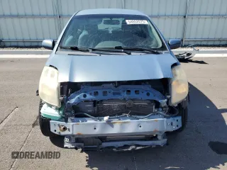2008 Toyota Yaris with VIN JTDJT923185164654, listed as a Copart auction lot 54052575 with 242,505 mi miles and Salvage Title. Bid and sale history available at DreamBid. Image 5.
